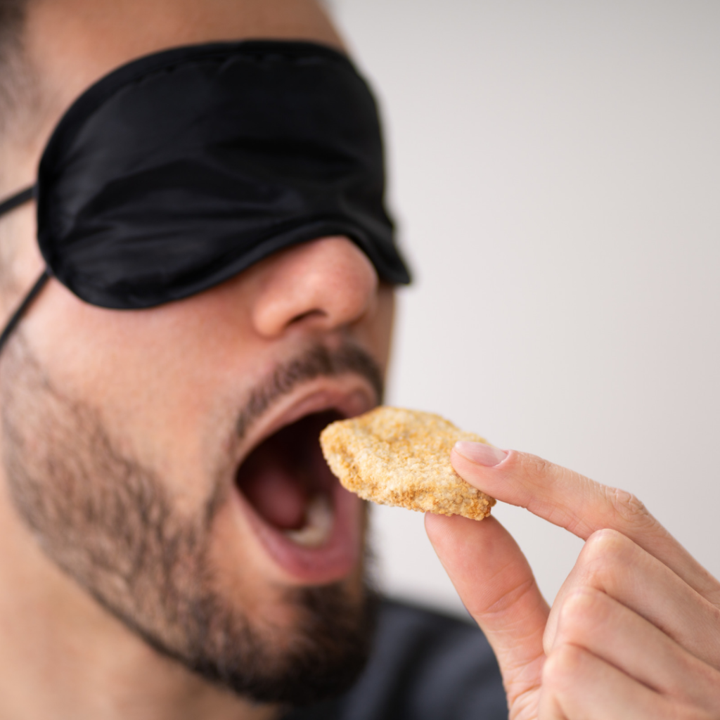 IgG food Intolerance test - Should I test for IBS? 2 man with a blindfold on eating a biscuit