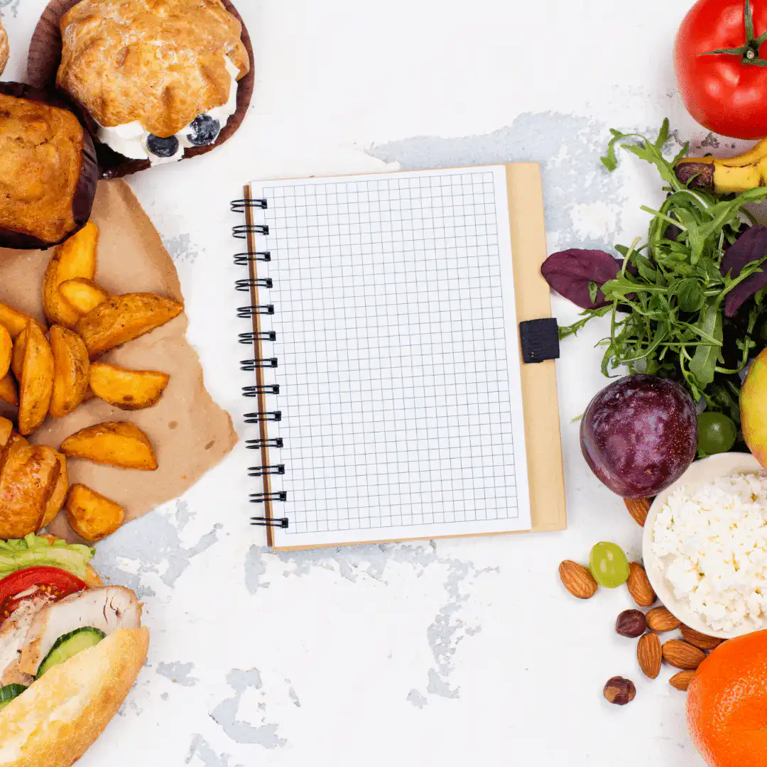 note book surrounded by food - goodness me nutrition