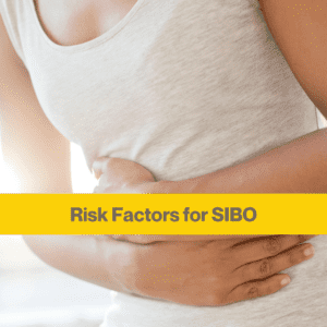 close up of a white person's arms holding their stomach, wearing a grey vest. Yellow banner with the words Risk Factors for SIBO across middle