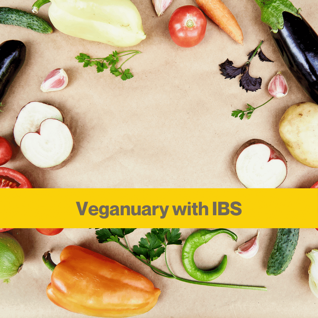 flat lay of vegetables in a circle against a pale wood board.
