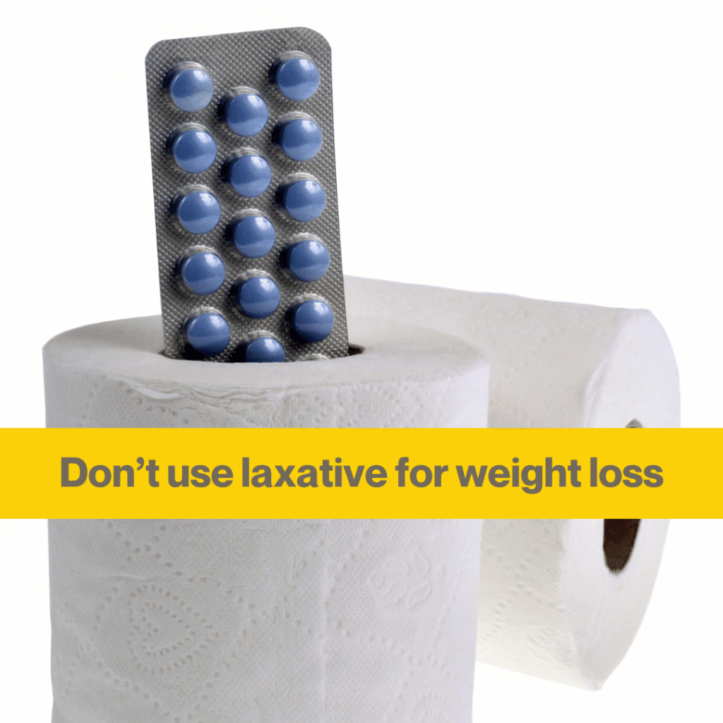 Why laxatives should never be used for weight loss 1 close up of a toilet roll with a packet of blue pills poking out. Words - Don't use laxatives for weight loss.