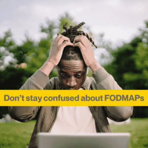 Man clutching his head looking confused, sitting in a garden with his laptop. Words - dont' stay confused about FODMAPS