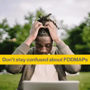 top confusing FODMAP foods (2) Man clutching his head looking confused, sitting in a garden with his laptop. Words - dont' stay confused about FODMAPS