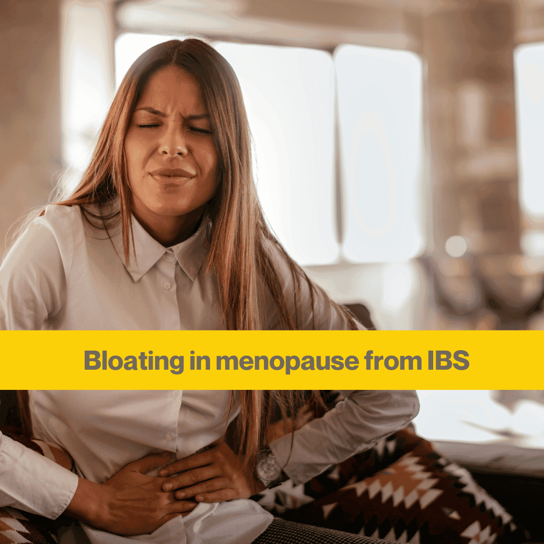 woman with long hair in white shirt eyes closed holding stomach. Words Bloating in menopause from IBS