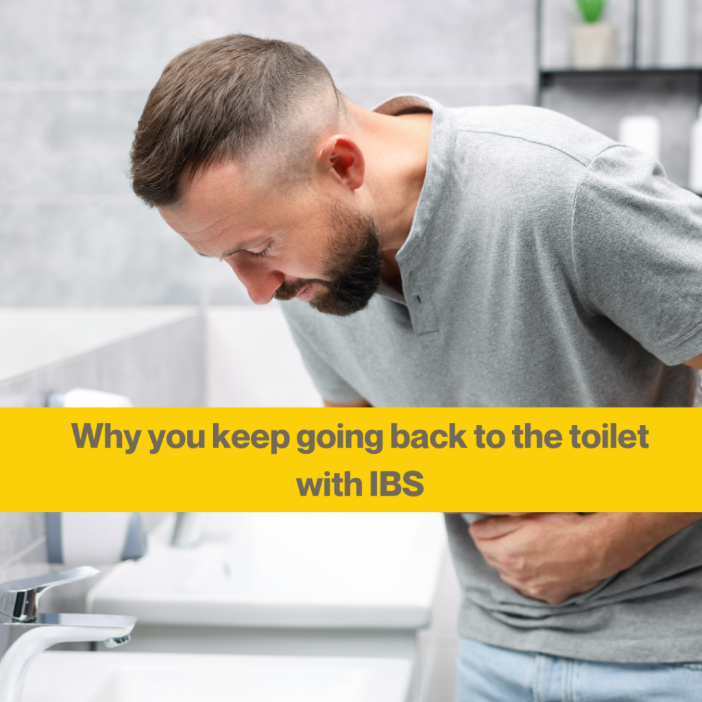 IBS toilet anxiety: are your coping habits making symptoms worse? 2 white man with short brown hair and a beard, wearing grey t shirt, bent over holding his stomach.