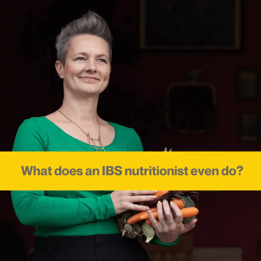 Anna Mapson, an IBS nutritionist, stands holding some vegetables.